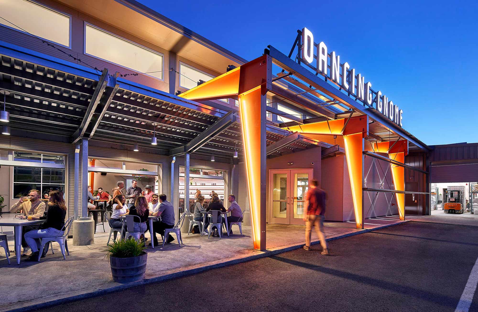 Colorful LED lighting illuminates large outdoor signage.