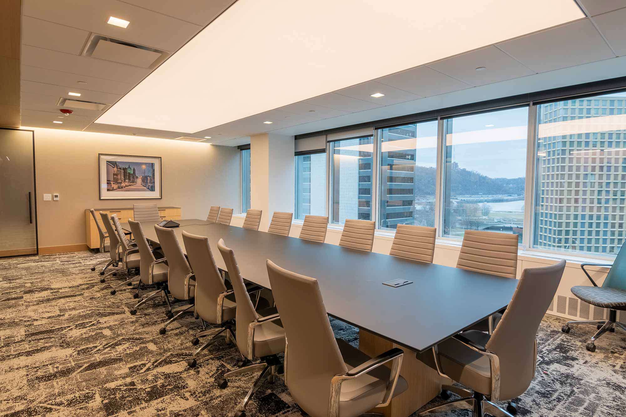 Panel lighting and square downlights in a boardroom