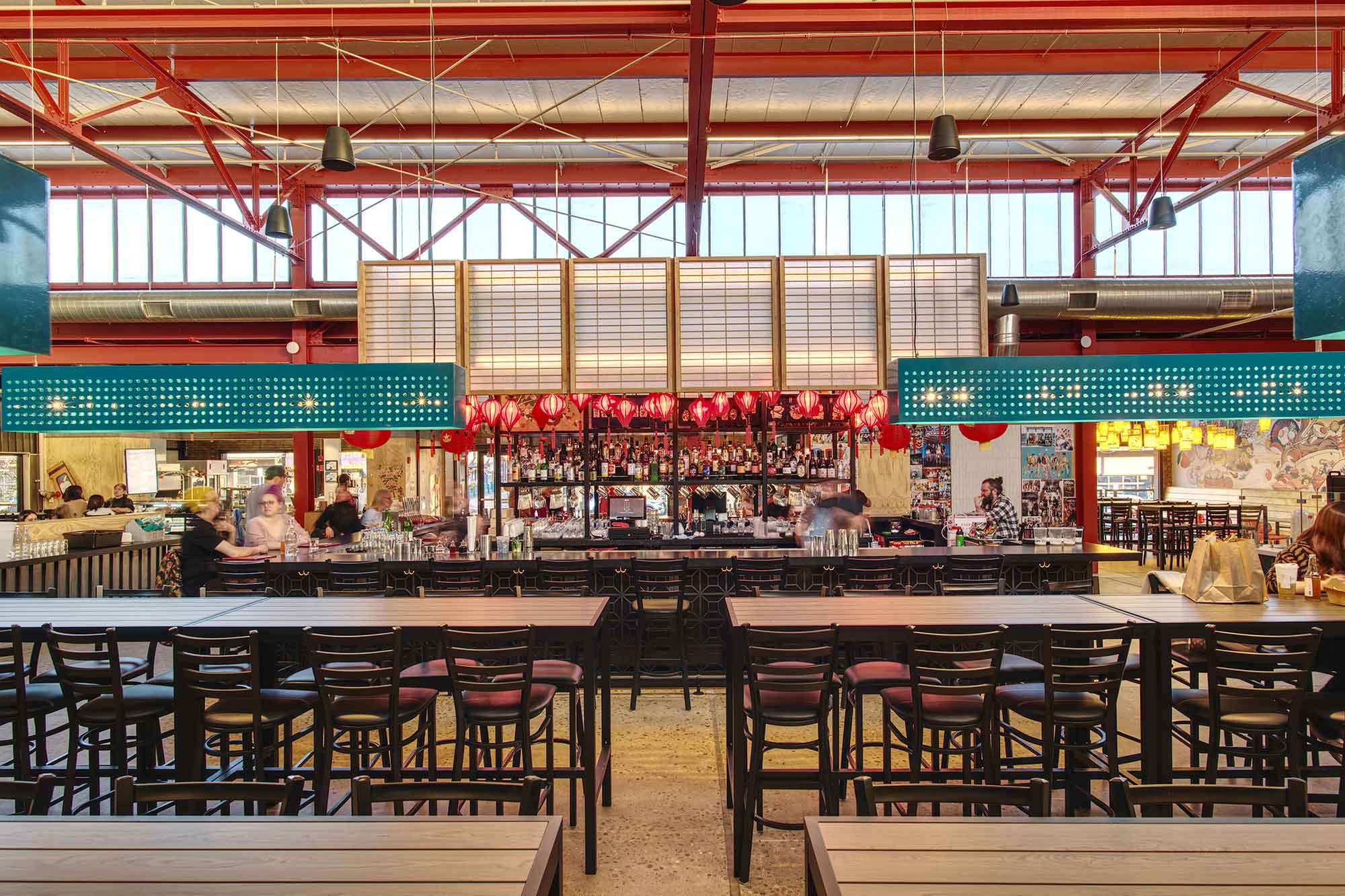 Various forms of colorful lighting in a multi-vendor food hall